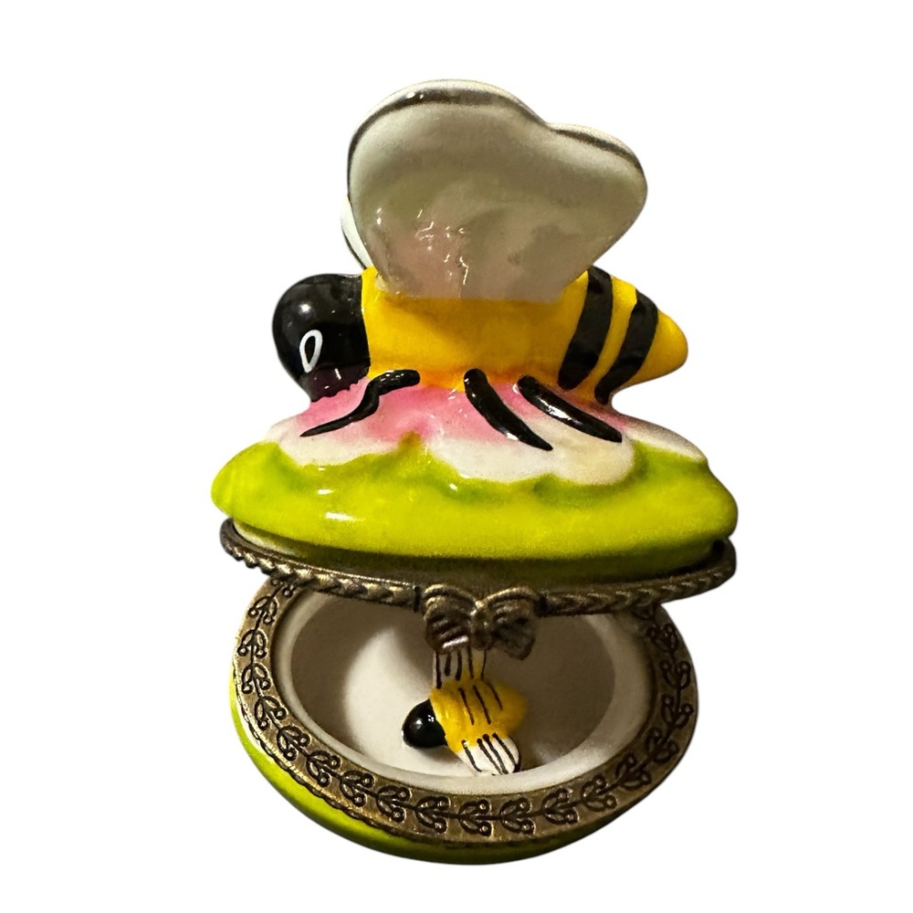 Porcelain trinket bee box with loose baby bee inside.
